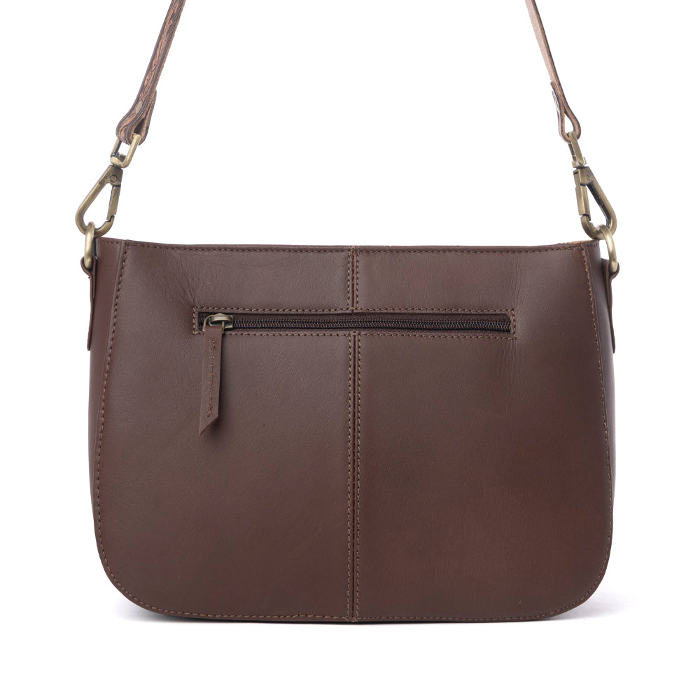 Myra Copper Crest Handtooled Hairon Leather Clutch in Saddle Walnut